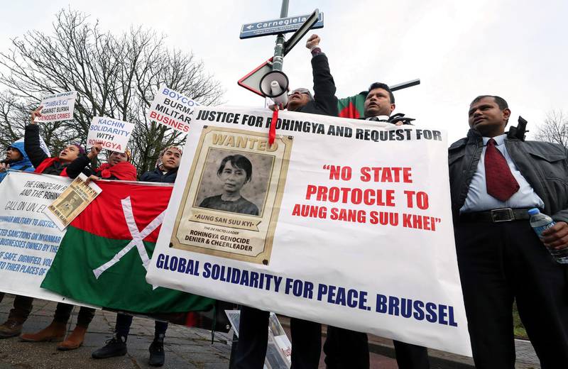 People demonstrate against Myanmar's leader Aung San Suu Kyi on the second day of hearings in a case filed by Gambia against Myanmar alleging genocide against the minority Muslim Rohingya population, outside the International Court of Justice (ICJ) in The Hague, Netherlands December 11, 2019. REUTERS/Yves Herman