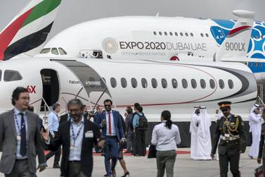 Delegates walk through an area with jets on display on the third day of the 2019 Dubai Airshow at Dubai World Central. Antonie Robertson / The National  