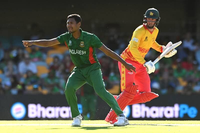 Mustafizur Rahman of Bangladesh gestures as Sean Williams of Zimbabwe runs between the wickets. Getty