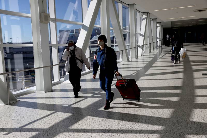 Travellers over the age of 2 should continue to wear face masks when flying, says the US CDC. Reuters