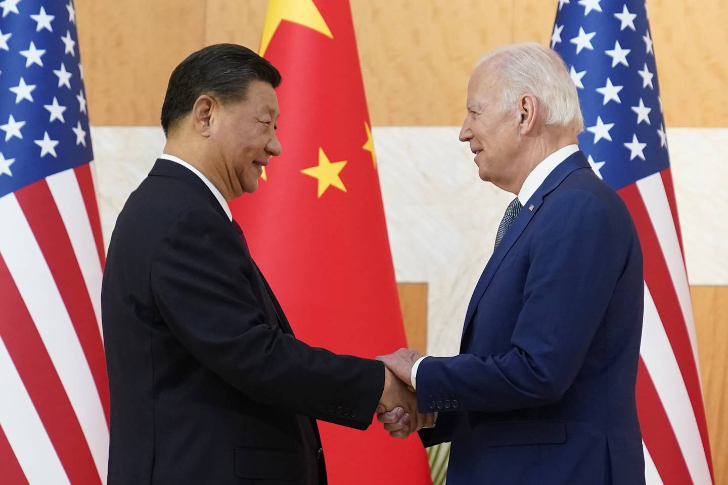 US President Joe Biden, right, and Chinese President Xi Jinping shake hands at the G20 summit in November. AP Photo