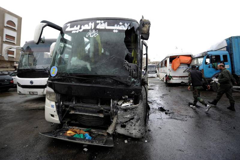 Damaged buses are pictured at the site of an attack by two suicide bombers in Damascus, Syria  March 11, 2017.  Omar Sanadiki/Reuters