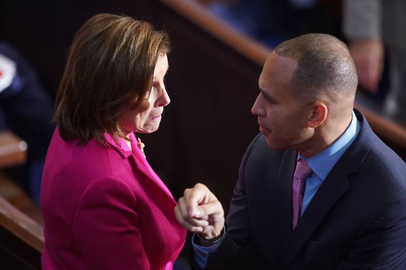 Representative Hakeem Jeffries, a Democrat from New York, right, speaks to Representative Nancy Pelosi, a Democrat from California, during the first session of the 118th Congress in the House Chamber in Washington, DC, US, on Tuesday, Jan.  3, 2023.  House GOP leader Kevin McCarthy again fell short of winning the speakership in the second round of voting as a small group of party dissidents continued their revolt in a stunning political rebuke to the California Republican that previews potential turmoil in the chamber over the next two years. Photographer: Al Drago / Bloomberg 