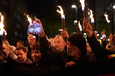 People attend a candlelit procession and vigil in the northern city Manchester to remember all those who have died due to the pandemic. Getty Images