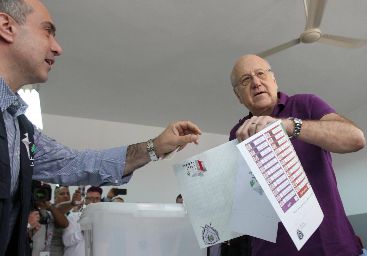 Lebanon's former Prime Minister and a candidate for the parliamentary election Najib Mikati, holds his ballot at a polling station in Tripoli, northern Lebanon, May 6, 2018. REUTERS/Omar Ibrahim