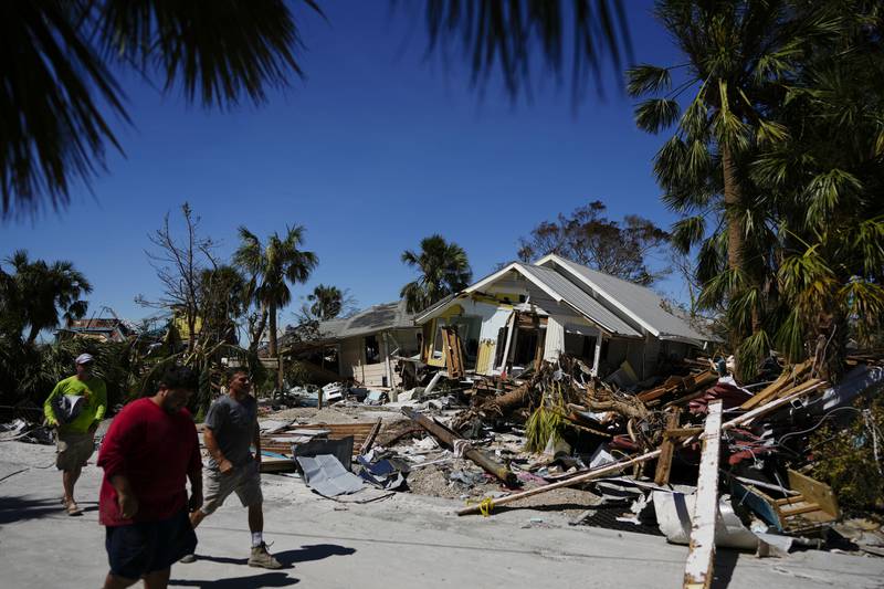 A damage survey party at work after Hurricane Ian hit Fort Myers Beach in Florida. AP