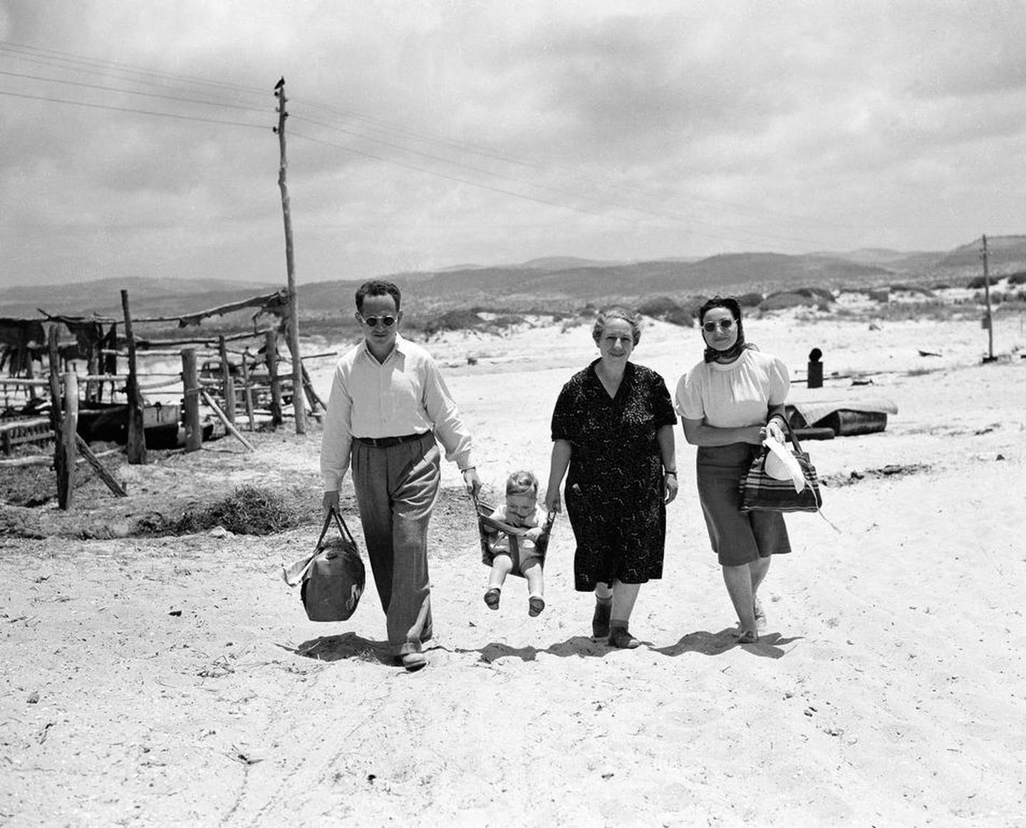 A family going for a stroll along the sea at a Jewish settlement in Palestine in June 1946. AP Photo