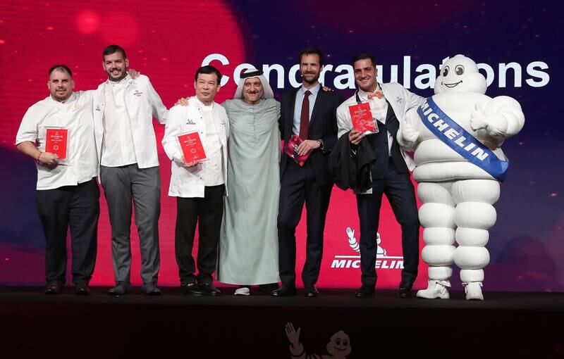 Saleh Mohamed Al Geziry, Director General Tourism Sector at the Department of Culture and Tourism – Abu Dhabi, with chefs from restaurants awarded one Michelin star.