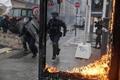 Riot police scuffle with protesters in Rennes. AP