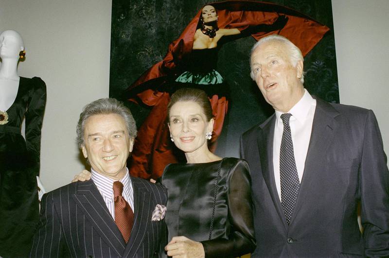 A photo from 1991 shows, from L to R : Victor Skrebneski, Audrey Hepburn and Hubert de Givenchy posing together at the Galliera Museum in Paris during a reception honouring 40 years of Givenchy's fashion.  AFP