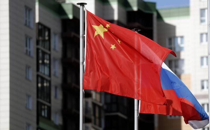 Both countries' national flags wave at the Russian-Chinese Greenwood business district in Moscow. EPA