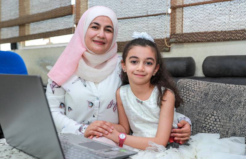 Abu Dhabi, United Arab Emirates, October 6, 2020.  Children of frontline workers receive free education from UAE government.  Dr. Abeer Darwish, Pediatrician at Medilinic with daughter Rand, eight, at their home at Mohammed Bin Zayed City.Victor Besa/The NationalSection:  NAReporter:  Sarwat Nasir