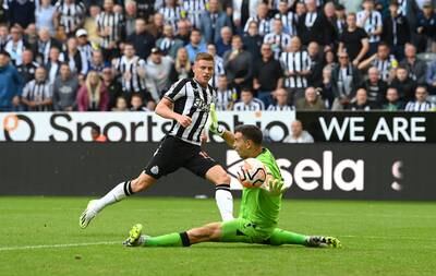 Harvey Barnes scores Newcastle's fifth goal past Villa goalkeeper Emiliano Martinez. Getty