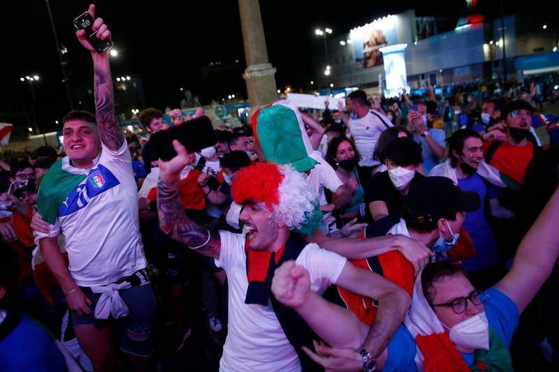 Italian fans celebrate in downtown Rome. AP
