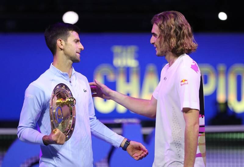 Novak Djokovic with Stefanos Tsitsipas after their match. Reuters