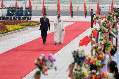 Sheikh Mohamed bin Zayed and Chinese President Xi Jingping wave at the children welcoming the Crown Prince of Abu Dhabi and Deputy Supreme Commander of the UAE Armed Forces to the Great Hall of the People in Beijing on Monday. Courtesy Sheikh Mohamed bin Zayed Twitter