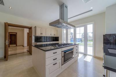 <p>The kitchen comes with stainless steel appliances with oven located on a central island.&nbsp;Courtesy LuxuryProperty.com</p>
