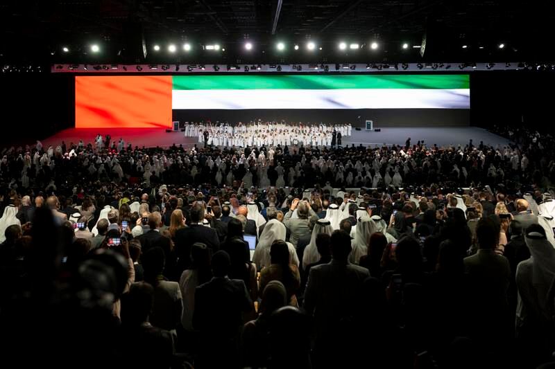 Guests stand for the national anthem during the opening ceremony of Abu Dhabi Sustainability Week. Photo: Presidential Court