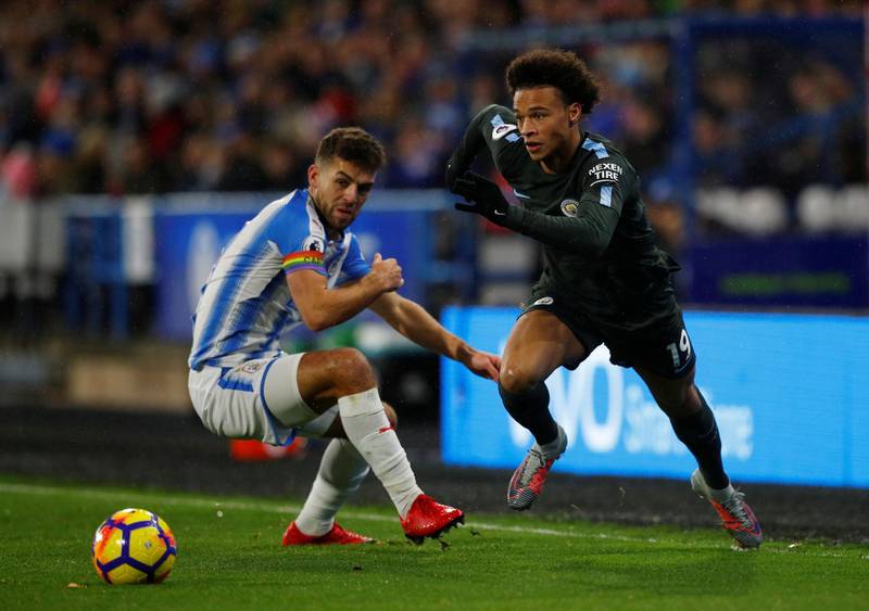 Soccer Football - Premier League - Huddersfield Town vs Manchester City - John Smith’s Stadium, Huddersfield, Britain - November 26, 2017   Manchester City's Leroy Sane in action with Huddersfield Town’s Tommy Smith      REUTERS/Phil Noble    EDITORIAL USE ONLY. No use with unauthorized audio, video, data, fixture lists, club/league logos or "live" services. Online in-match use limited to 75 images, no video emulation. No use in betting, games or single club/league/player publications. Please contact your account representative for further details. - RC1780D4C4C0