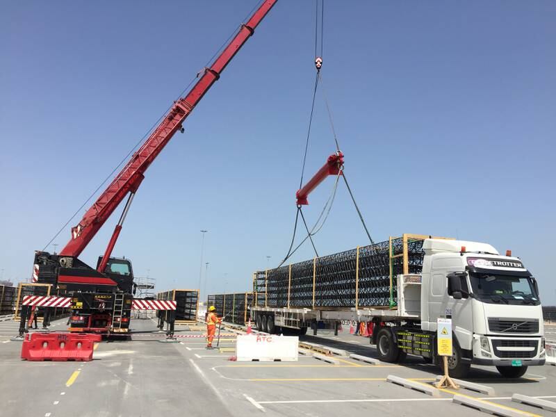 Towering Expo entry portals transported at night on trailer trucks from Germany to Antwerp and shipped to Jebel Ali and onto the Expo site in Dubai.
