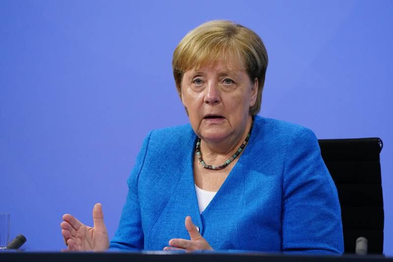 German Chancellor Angela Merkel speaks after a virtual meeting with state premiers about the current coronavirus situation at the Chancellery in Berlin. EPA