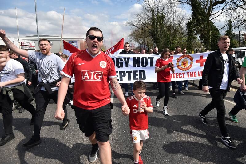 Manchester United fans take part in a protest outside the stadium. Getty
