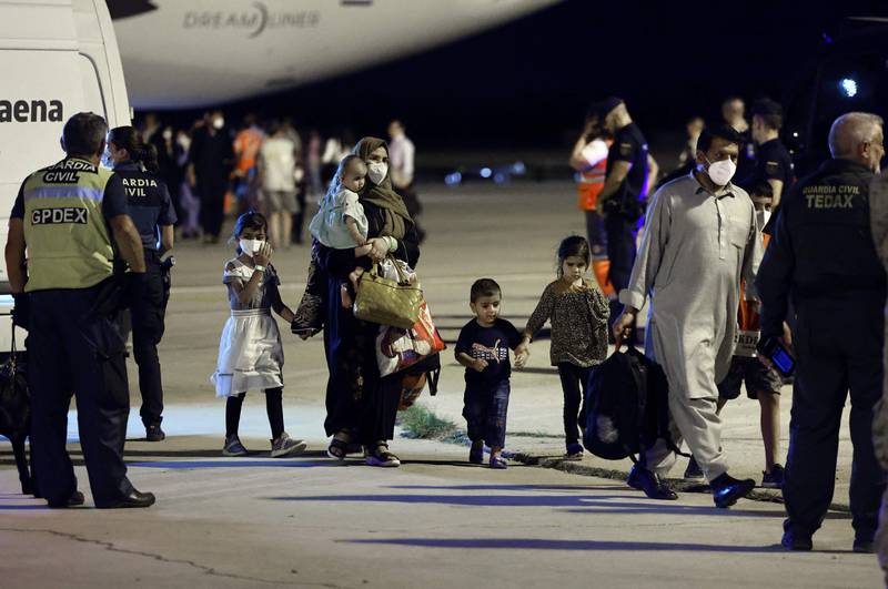 Afghans families arrive in Spain from Islamabad, one year on from the fall of Kabul. AFP