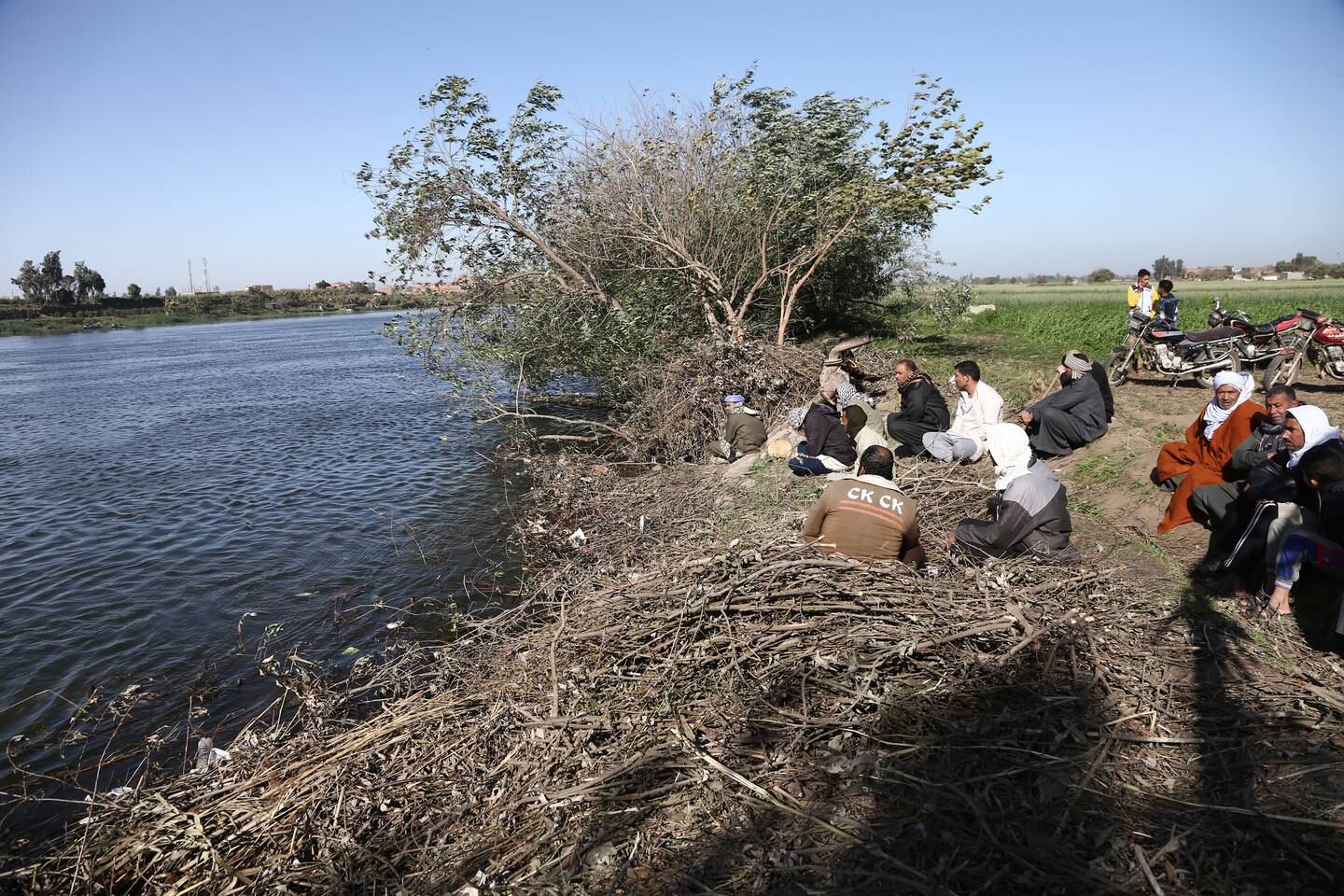 Egyptians watch as Rescue personnel conduct a search operation on the River Nile for possible victims after a truck fell off a ferry. EPA