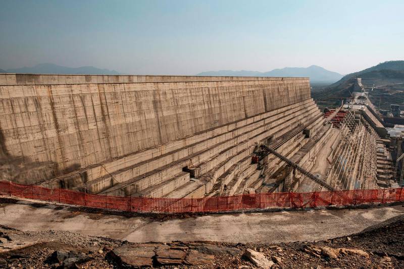 (FILES) In this file photo taken on December 26, 2019, a general view of the Grand Ethiopian Renaissance Dam (GERD), near Guba in Ethiopia. As Egypt, Ethiopia and Sudan struggle to resolve a long-running dispute over Addis Ababa's mega-dam project on the Nile, some of their citizens are sparring online over their rights to the mighty waterway. For nearly a decade, multiple rounds of talks between Cairo, Addis Ababa and Khartoum have failed to produce a deal over the filling and operation of the Grand Ethiopian Renaissance Dam (GERD). / AFP / EDUARDO SOTERAS
