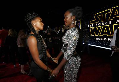 Actress Lupita Nyong’o, right, and singer Janelle Monae chat as they arrive at the premiere of Star Wars: The Force Awakens. Mario Anzuoni / Reuters