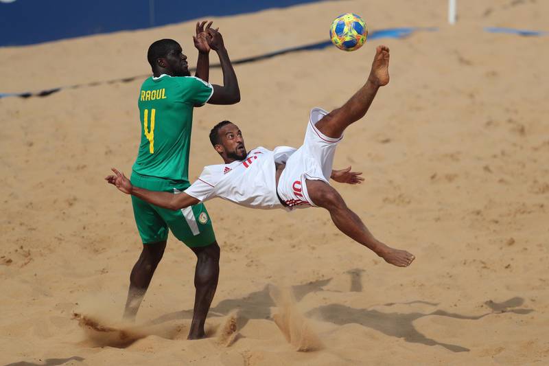 epa08027995 Senegal's Raoul Mendy vies for the ball against Walid Mohammad (R) of United Arab Emirates, during a Group C match of the 2019 FIFA Beach Soccer World Cup, between Senegal and United Arab Emirates, at the Los Pynandi Stadium in Luque, Paraguay, 26 November 2019.  EPA/Fernando Bizerra jr