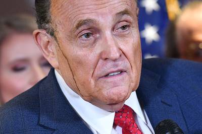 Trump's personal lawyer Rudy Giuliani perspires as he speaks at Republican National Committee headquarters in Washington. AFP