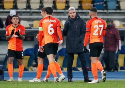 Shakhtar Donetsk manager Luis Castro celebrates with his players at the end of the match after beating Real Madrid. Reuters