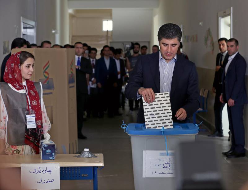 Prime Minister of Iraqi Kurdistan Nechirvan Barzani, right, casts his vote in the Kurdistan parliamentary election at a polling station in Erbil, the capital of the Kurdistan Region in Iraq.  EPA