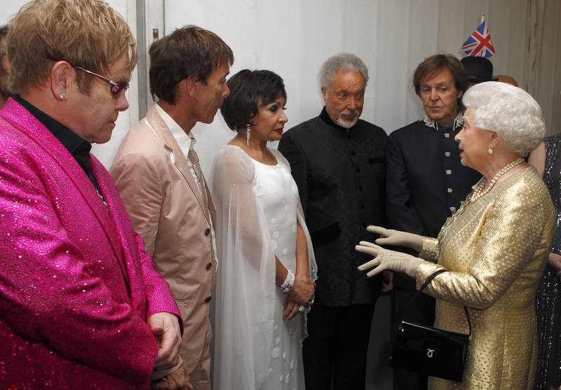 Queen Elizabeth meets Sir Elton John, Sir Cliff Richard, Dame Shirley Bassey, Sir Tom Jones and Sir Paul McCartney backstage after the diamond jubilee Buckingham Palace concert in June 2012. Getty Images