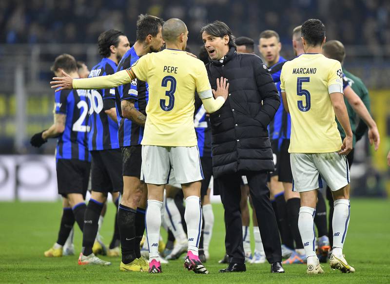 Inter Milan coach Simone Inzaghi clashes with Porto's Pepe and Ivan Marcano. Reuters