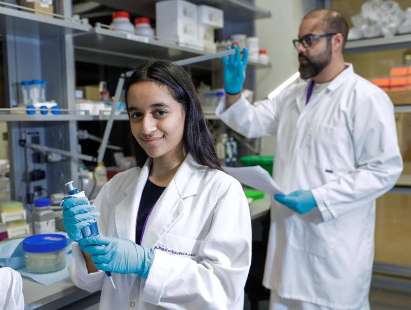 Abu Dhabi, United Arab Emirates, March 7, 2019.  Alia Al Mansoori gets trained on proper laboratory procedures by NYUAD Research Assistant Professor, Mohamed Al Sayegh. Victor Besa/The NationalSection:  NAReporter:  Dan Sanderson