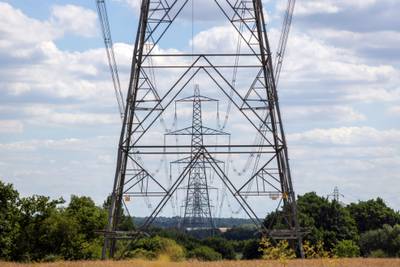 Electricity transmission towers in the UK.  Consumers are facing a cost-of-living crisis as energy costs spiral. Bloomberg