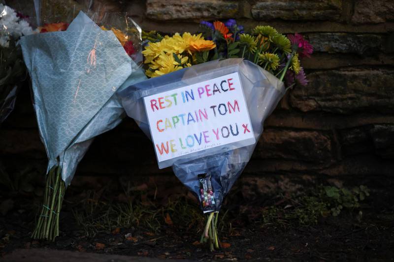 Flowers are seen at the entrance of The Coach House, the residence of Captain Sir Tom Moore, after his family announced that the centenarian fundraiser had died. Reuters