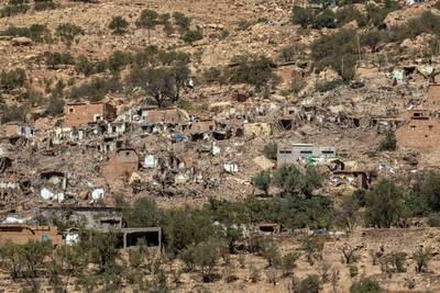 Buildings lie in ruins in Douzrou. Getty Images