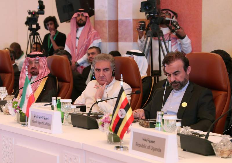 Iranian Director General of the Department of International Peace and Security Affairs Reza Najafi, right, and Pakistani Foreign Minister  Shah Mehmood Qureshi, centre, attend the meeting in Jeddah.  AFP