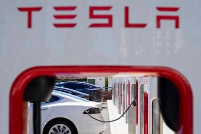 Tesla vehicles charge at a station in Emeryville, California. AP