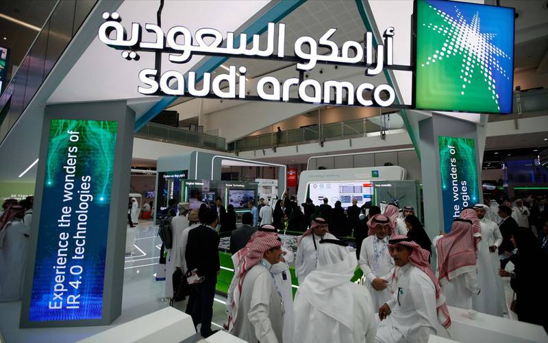 epa07989048 Visitors gather at Saudi's Aramco section during Abu Dhabi International Petroleum Exhibition and Conference (ADIPEC) in Abu Dhabi, United Arab Emirates, 11 November 2019. ADIPEC, a meeting place of the international oil and gas community, runs between 11 and 15 November 2019.  EPA/ALI HAIDER