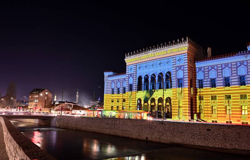 Sarajevo City Hall floodlit in blue and yellow in Bosnia. AFP