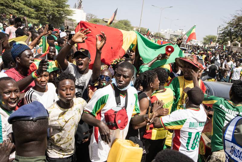 Supporters cheers ahead of Senegal team's arrival in Dakar a day after the national team defeated Egypt in the Africa Cup of Nations final. AFP