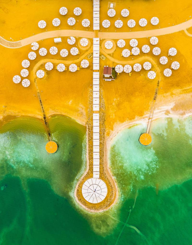 'Space Invaders', The Dead Sea (Israel), by Gilad Topaz, highly commended in the Urban category. The shot captures white parasols at a beach on the Dead Sea.