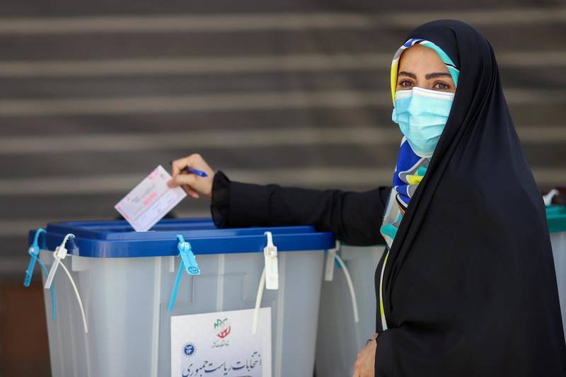 An Iranian woman casts her vote during presidential elections at a polling station in Tehran. Reuters