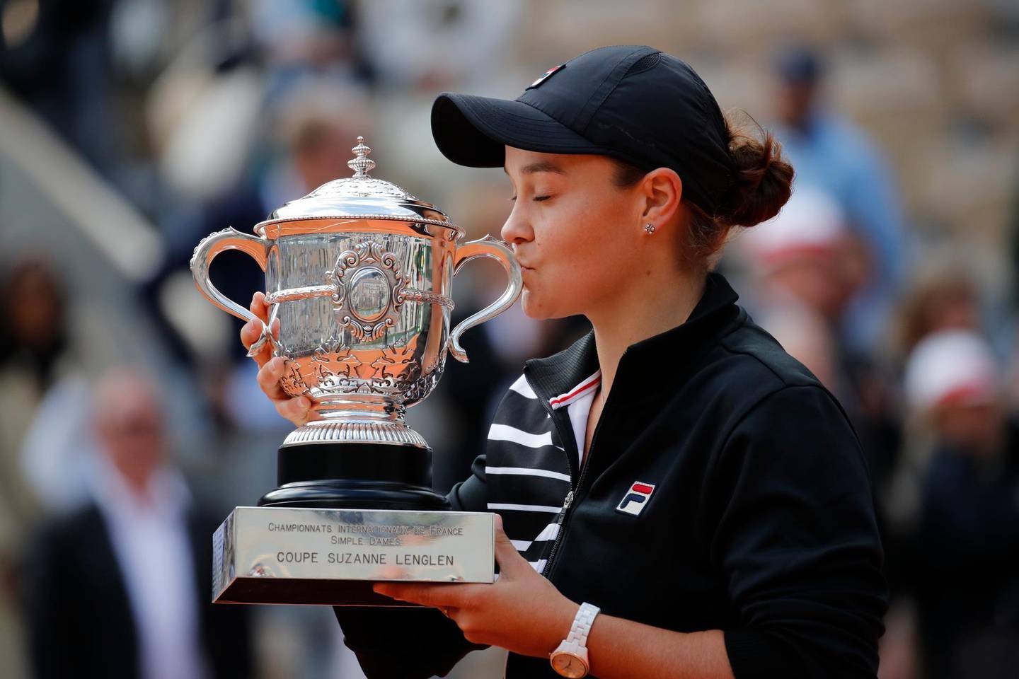 Australia's Ashleigh Barty kisses the trophy as she celebrates winning her women's final match of the French Open tennis tournament against Marketa Vondrousova of the Czech Republic in two sets 6-1, 6-3, at the Roland Garros stadium in Paris, Saturday, June 8, 2019. (AP Photo/Christophe Ena)