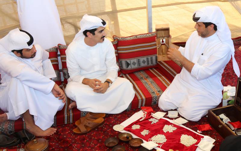 Sheikh Dr Majid Sultan Al Qasimi and Abdullah Al Suwaidi, founder of Suwaidi Pearls, at Al Suwaidi Pearl Farm. Courtesy Ministry of Climate Change and Environment