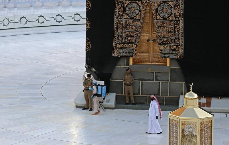 Saudi policemen stand guard next to the Kaaba in Makkah's Grand Mosque on the first day of Ramadan. AFP